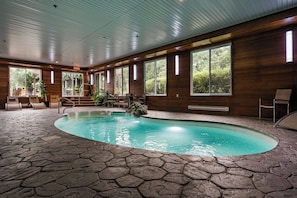 Indoor pool, open 8:00 AM to 11:00 PM, pool loungers