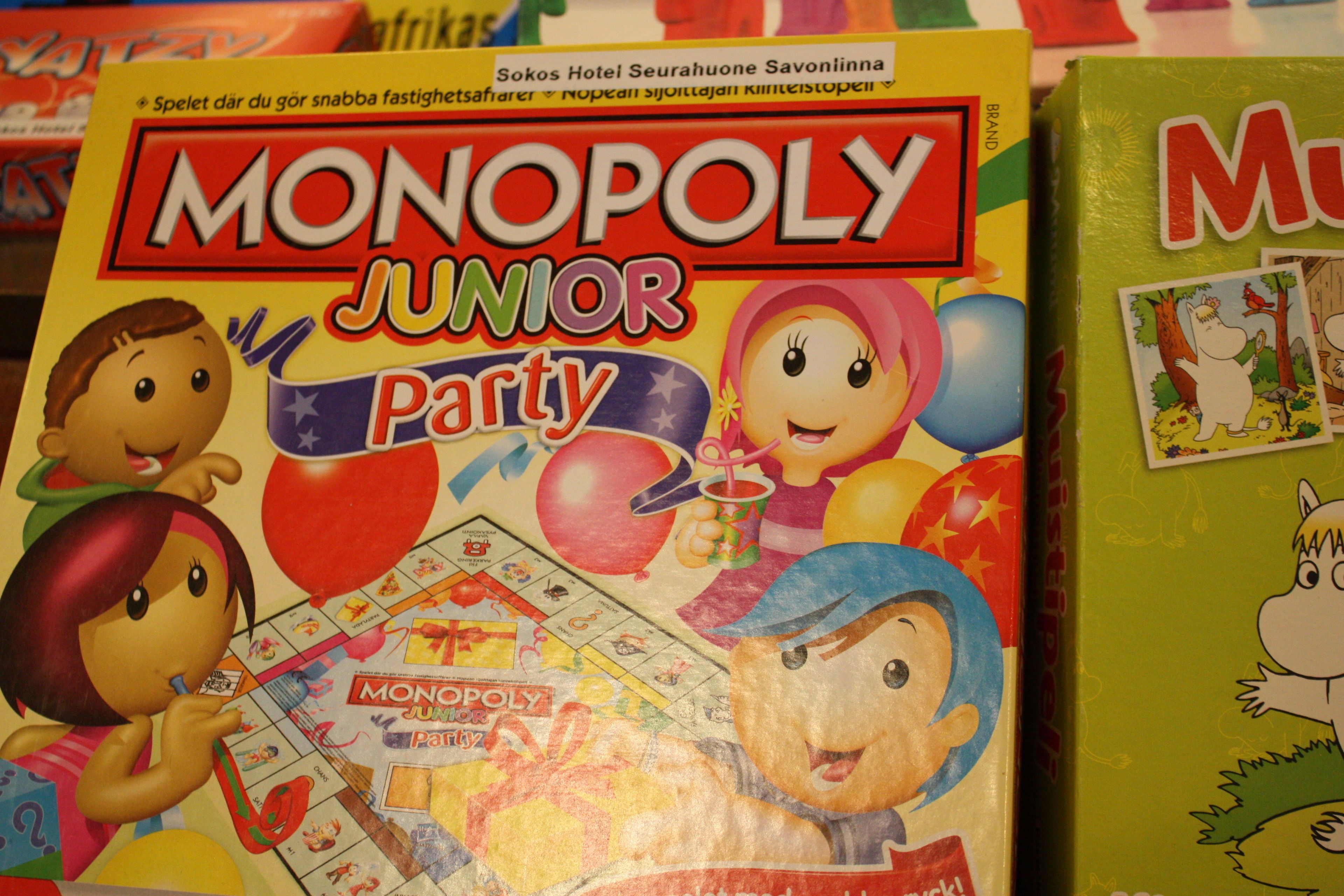 A Monopoly Junior Party board game with colorful characters and a party theme.