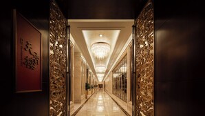 A long, well-lit hallway with ornate golden doors and a chandelier. - Intercontinental Changzhou by IHG (Changzhou)