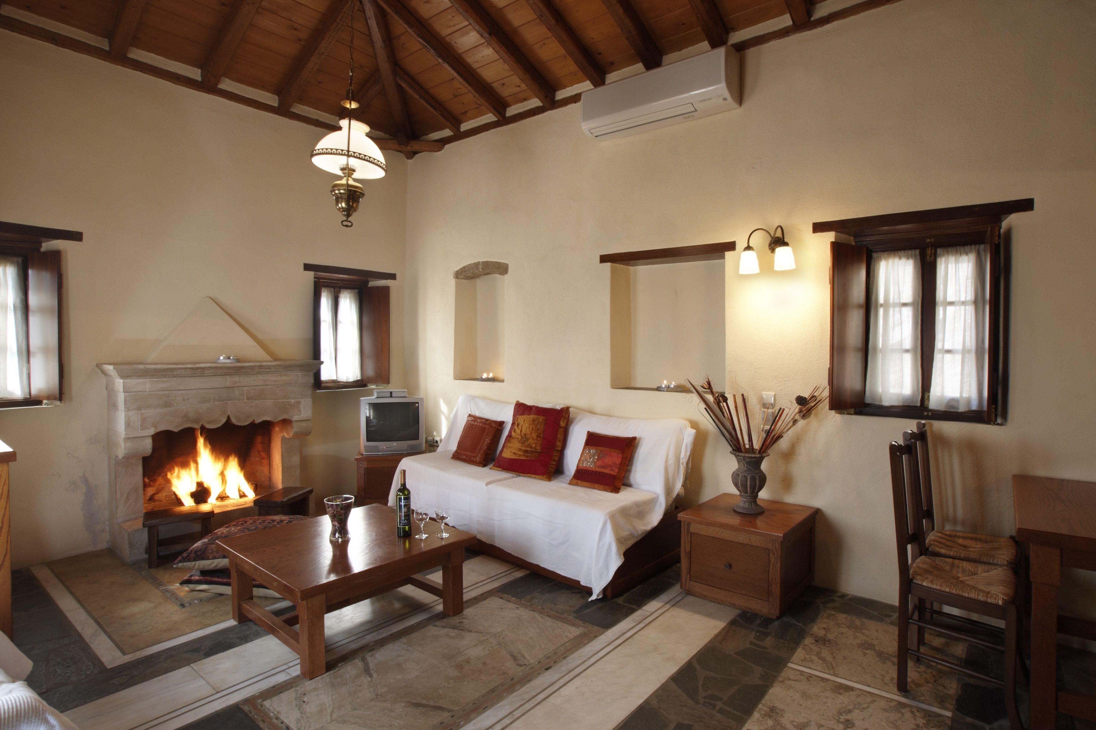 family suite, 1 bedroom, kitchenette, sea view | living area | flat-screen tv