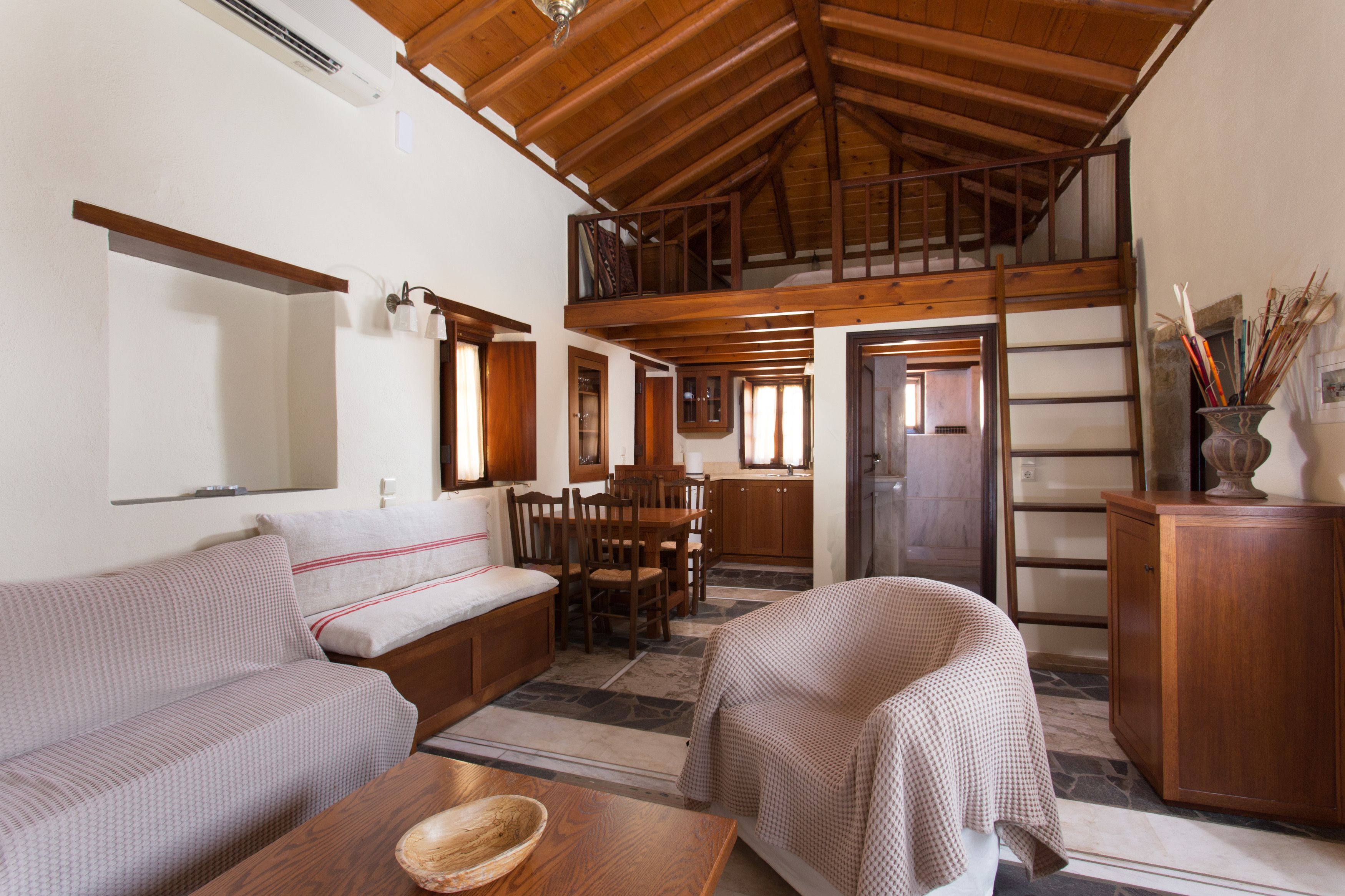 family suite, 1 bedroom, kitchenette, sea view | living area | flat-screen tv