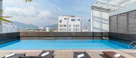 Outdoor pool, pool umbrellas, pool loungers