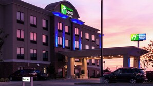 A Holiday Inn Express hotel with a modern design, featuring a prominent sign and a well-lit entrance. - Holiday Inn Express Hotel & Suites El Reno by IHG (El Reno)