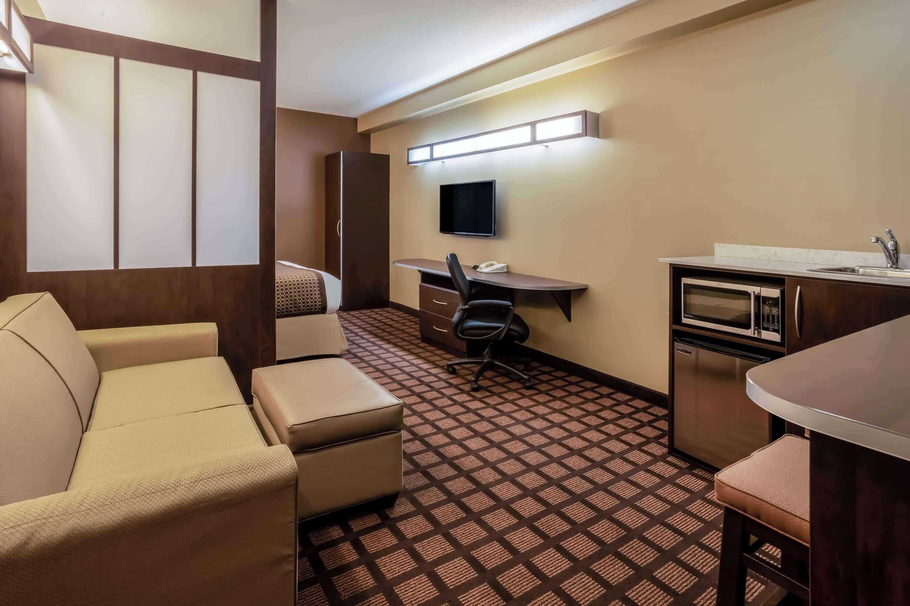 desk, laptop workspace, iron/ironing board, rollaway beds