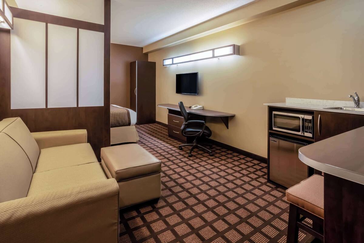 desk, laptop workspace, iron/ironing board, rollaway beds