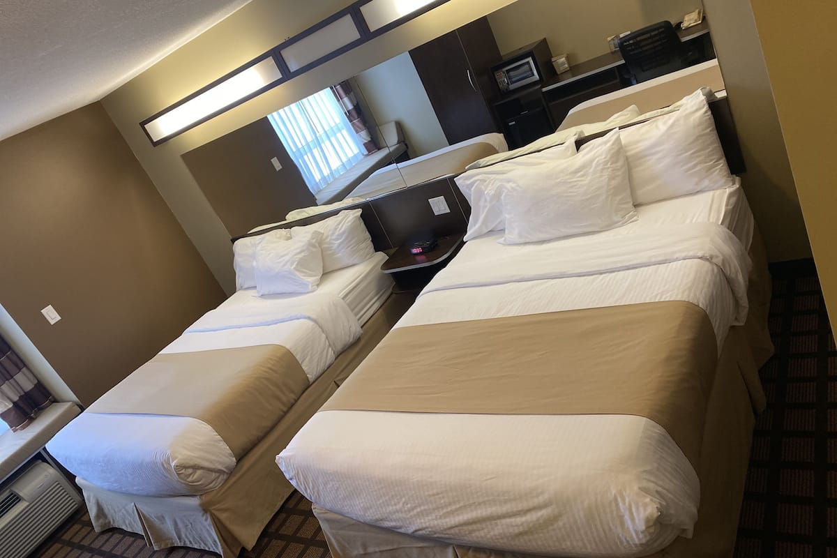 desk, laptop workspace, iron/ironing board, rollaway beds