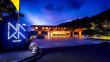 A modern building with a prominent illuminated sign reading "NN THE PHUKET."
