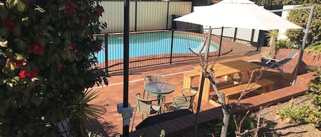 Seasonal outdoor pool, pool loungers