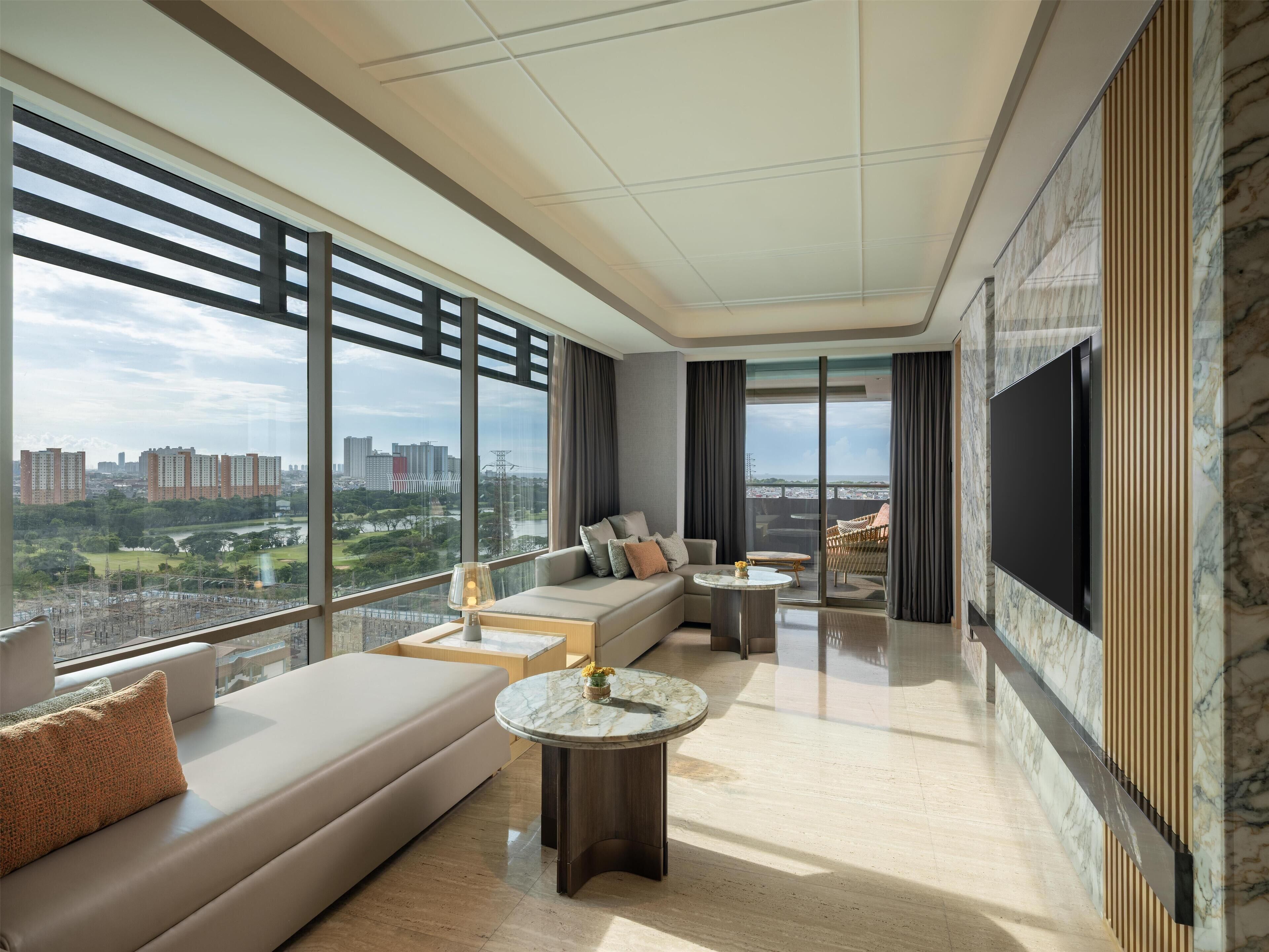 Premium Suite, 1 King Bed, Balcony | Living area | 32-inch TV with satellite channels