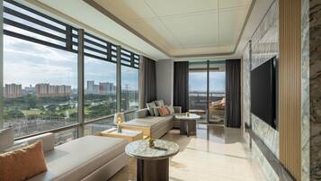 Premium Suite, 1 King Bed, Balcony | Living area | 32-inch TV with satellite channels