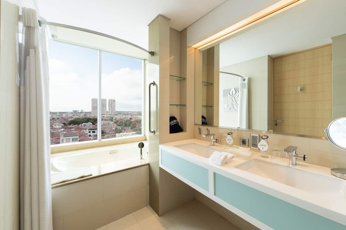 premium suite, 1 king bed, balcony | bathroom | free toiletries, hair dryer, slippers, bidet