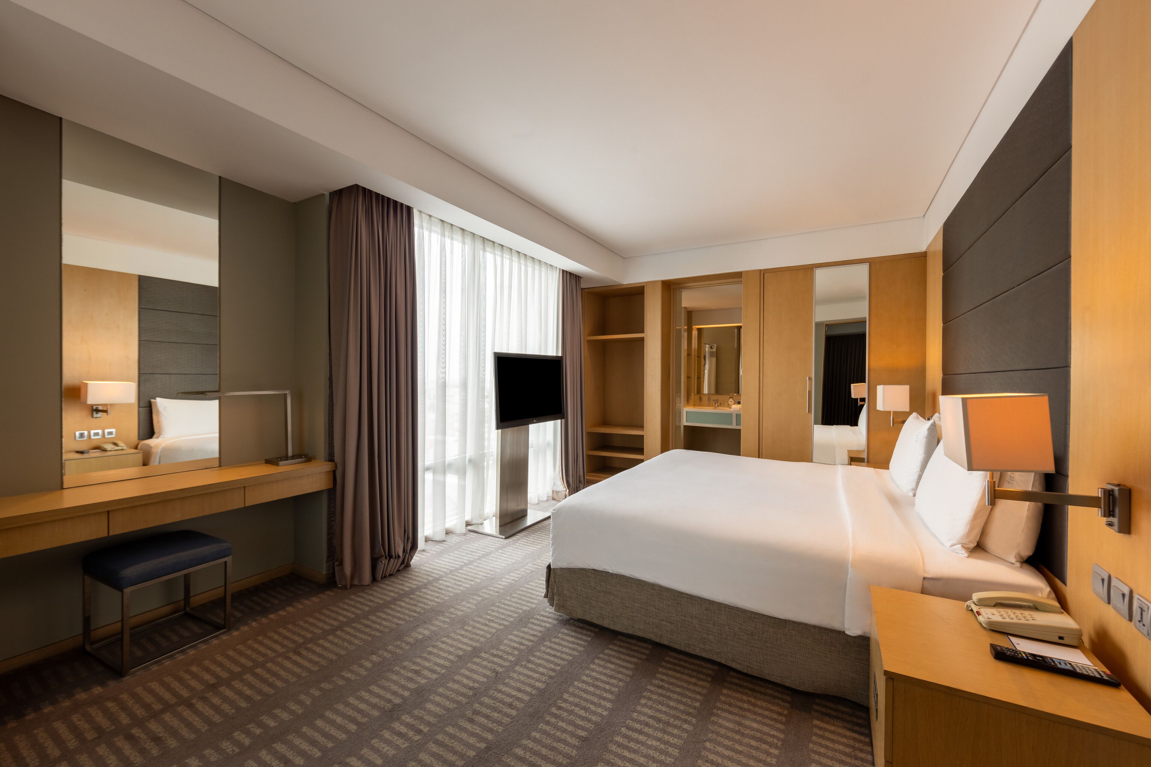 premium suite, 1 king bed, balcony | in-room safe, desk, laptop workspace, blackout curtains