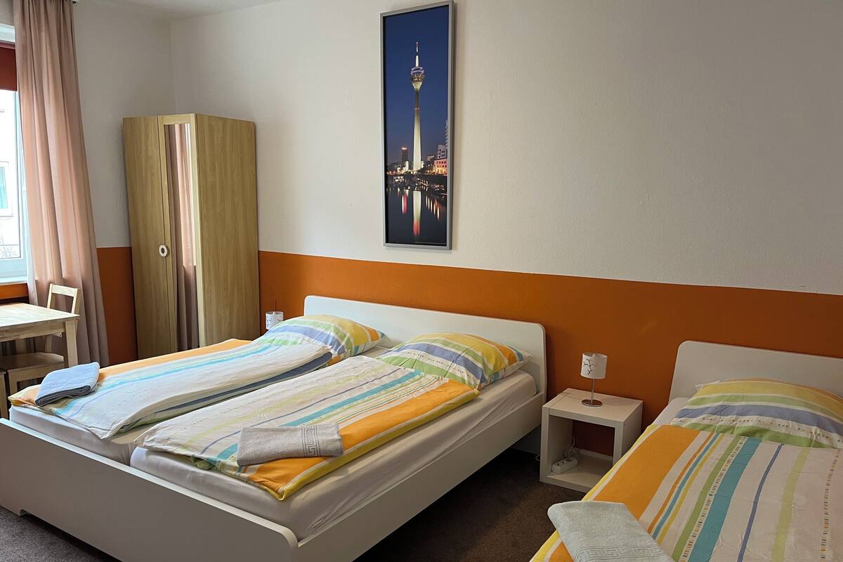 Triple Room, Non Smoking, Shared Bathroom | Iron/ironing board (on request), free WiFi, bed sheets