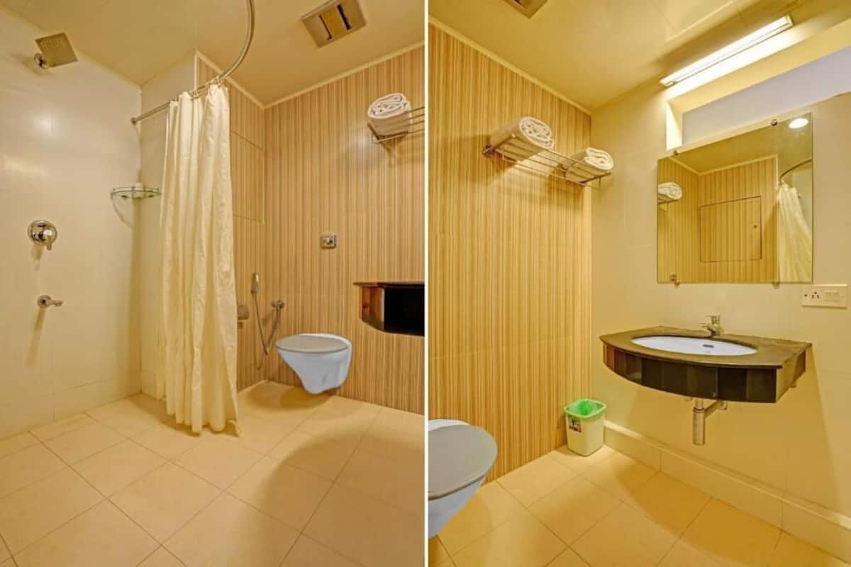 deluxe double or twin room | bathroom | shower, rainfall showerhead, free toiletries, hair dryer