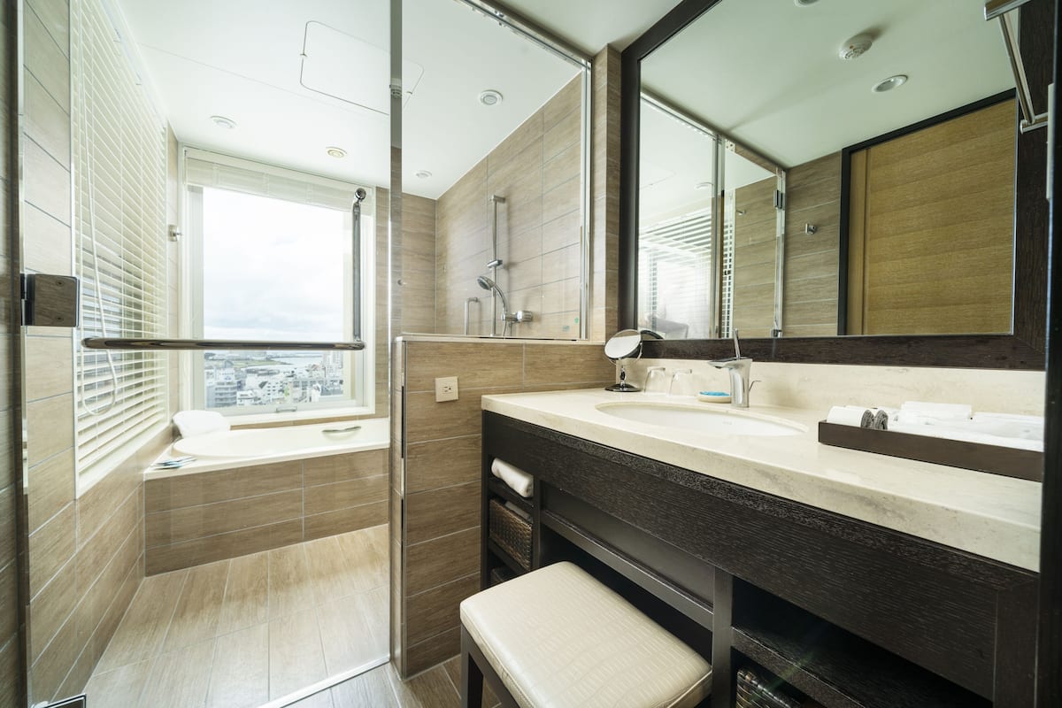 separate bathtub and shower, deep-soaking bathtub, designer toiletries