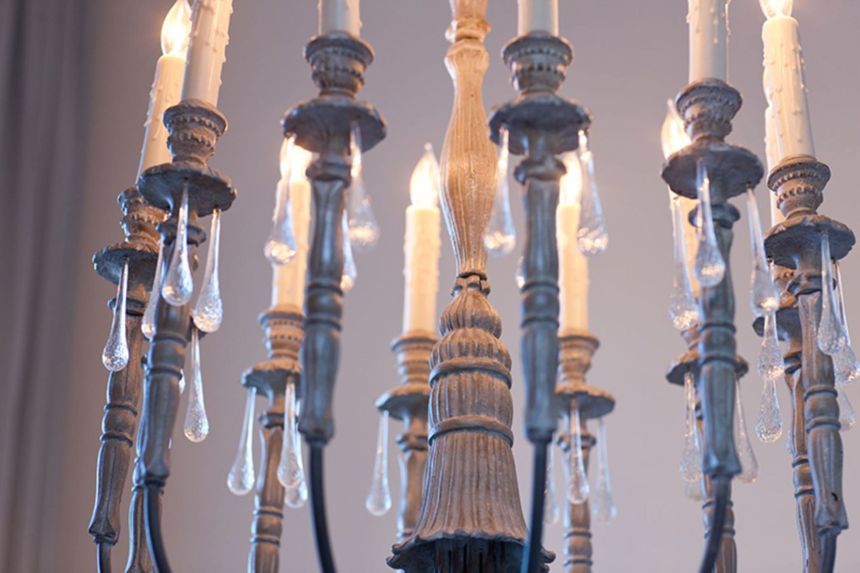 A chandelier with multiple candles and icicles.