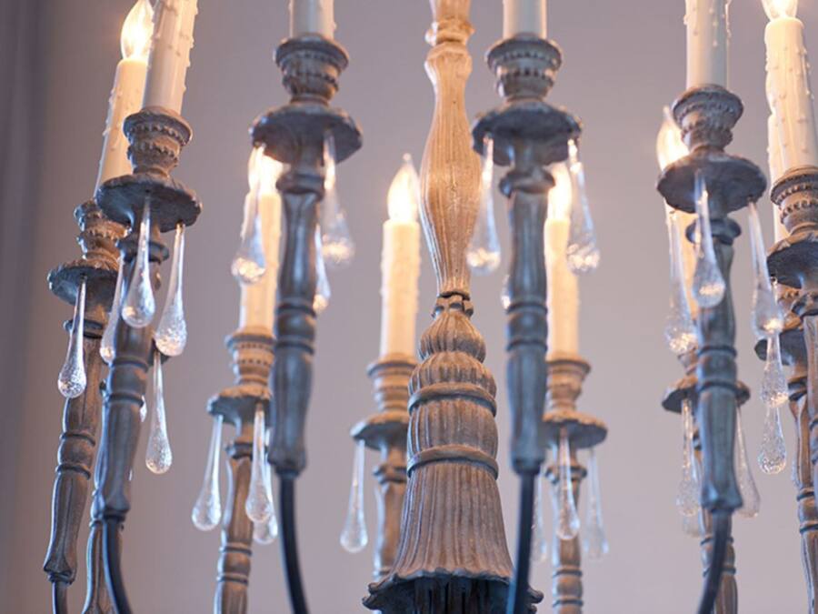 A chandelier with multiple candles and icicles.