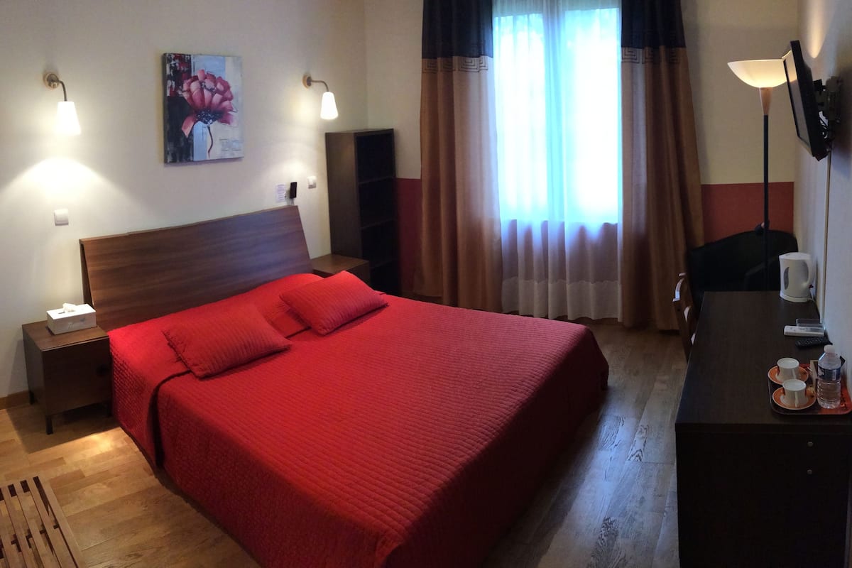 standard double room, garden view | pillow-top beds, individually furnished, desk, blackout curtains