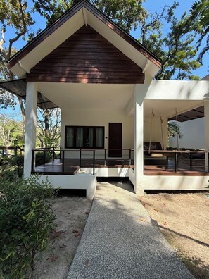 A modern building with a covered porch and a staircase leading to a second level. - The Vatika Resort and Spa (Krabi)