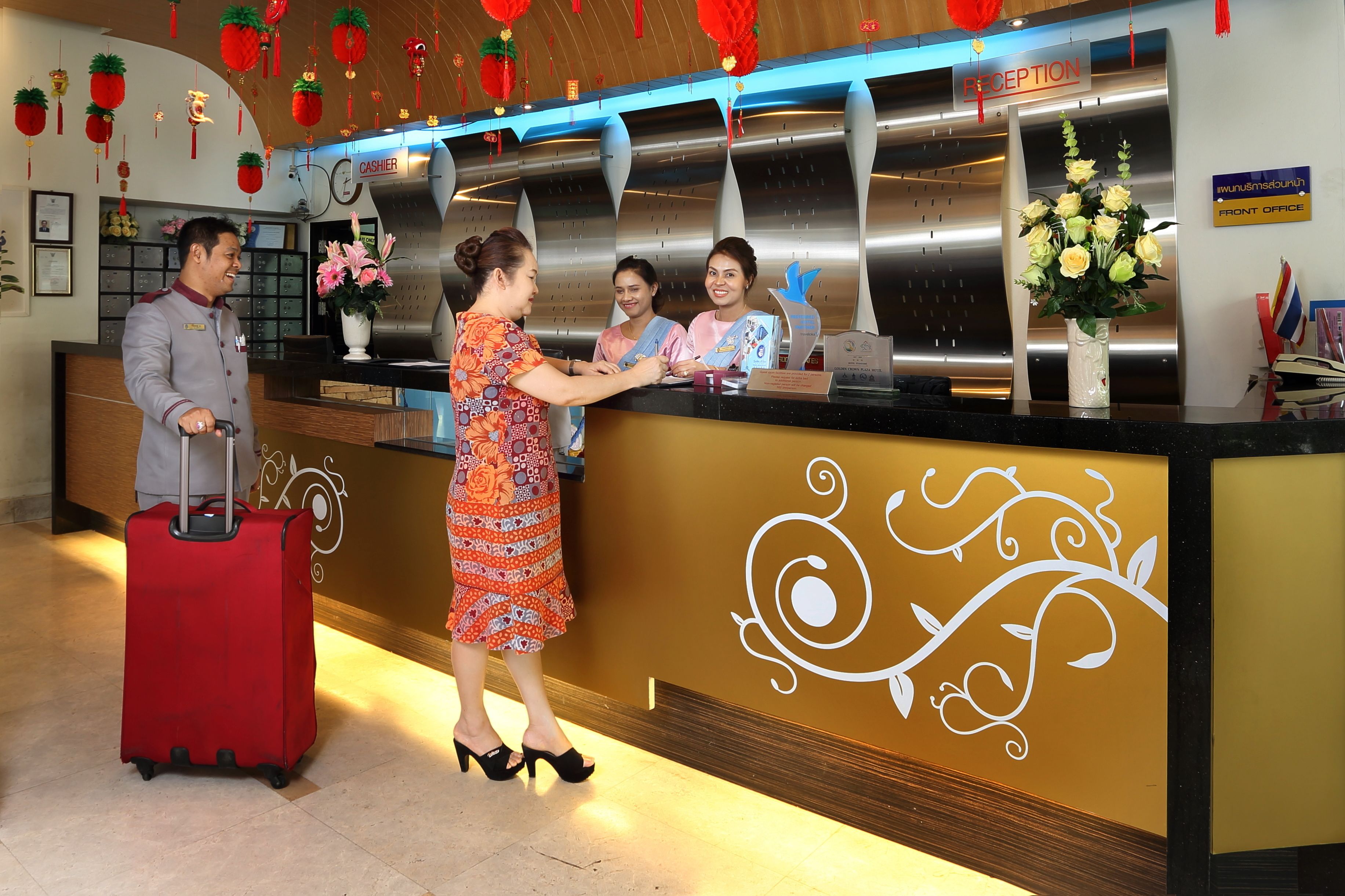 A reception area with a reception desk, a cash register, and a sign indicating the front office.