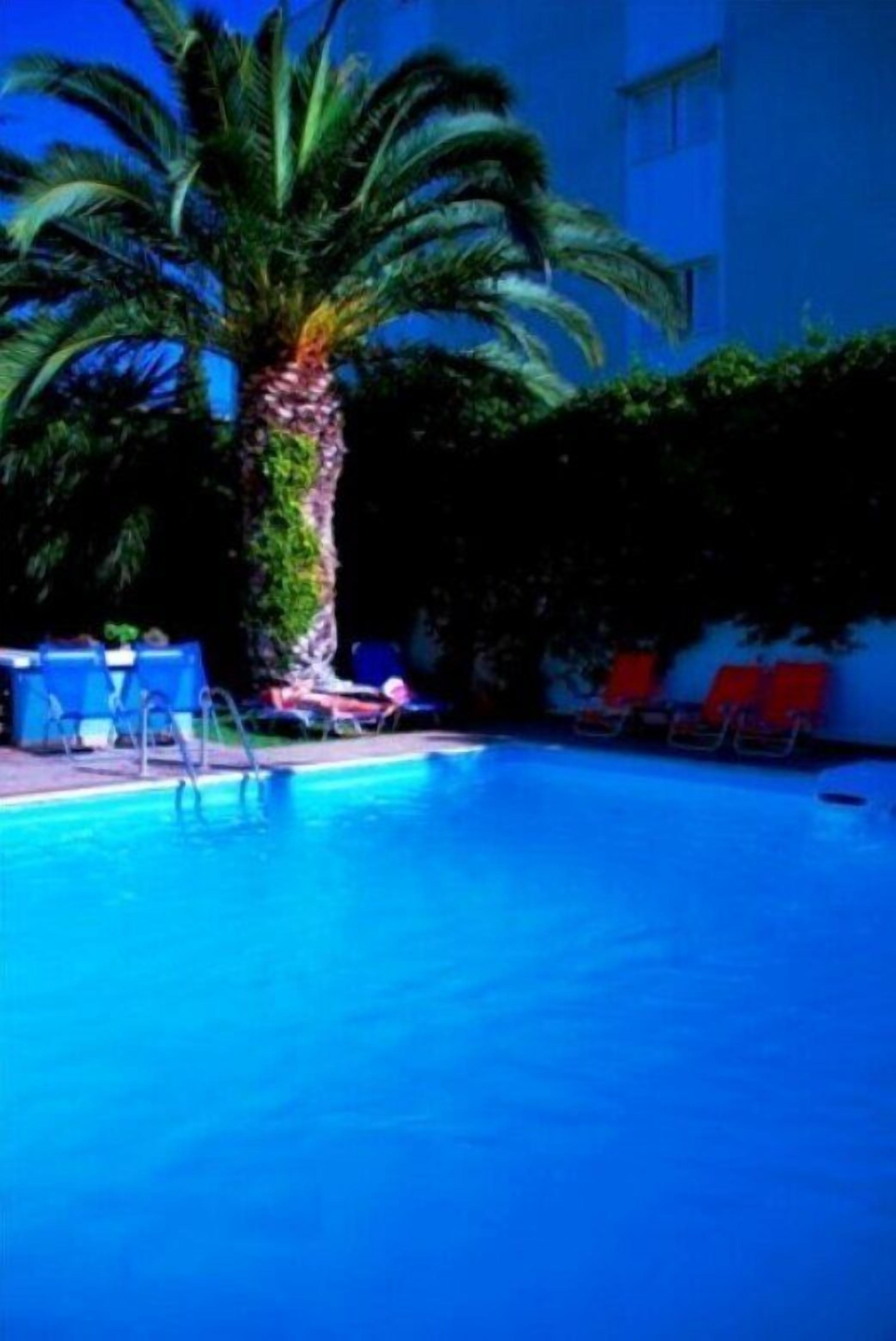 Seasonal outdoor pool, open 11:00 AM to 8:00 PM, pool umbrellas