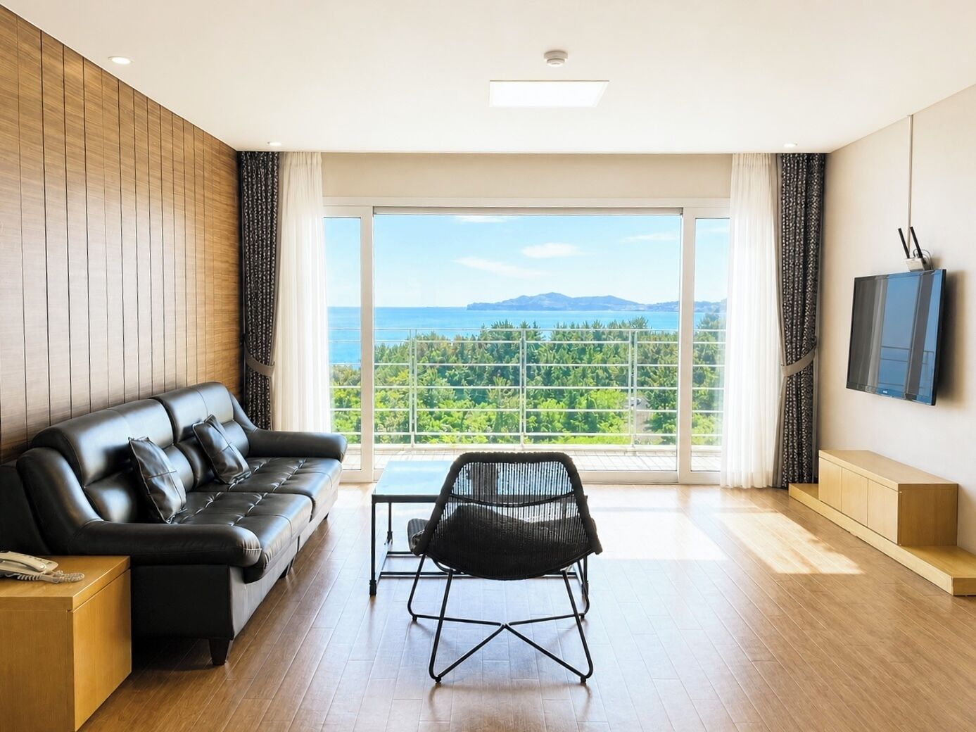 Luxury Suite, 2 Bedrooms, Hot Tub, Ocean View | Living area | 41-inch LCD TV with cable channels, TV, heated floors