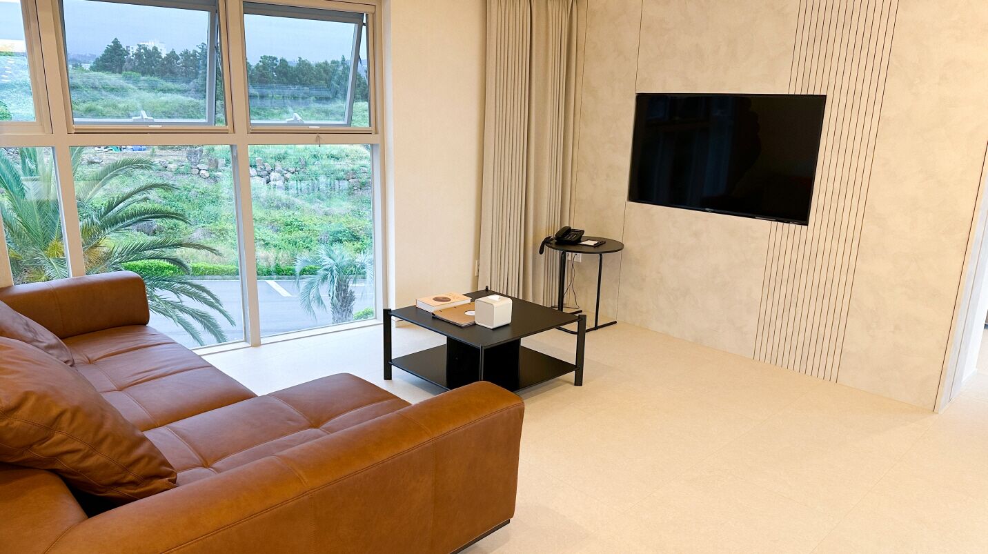 penthouse, 2 bedrooms, private pool | living area | 41-inch lcd tv with cable channels, tv, heated floors