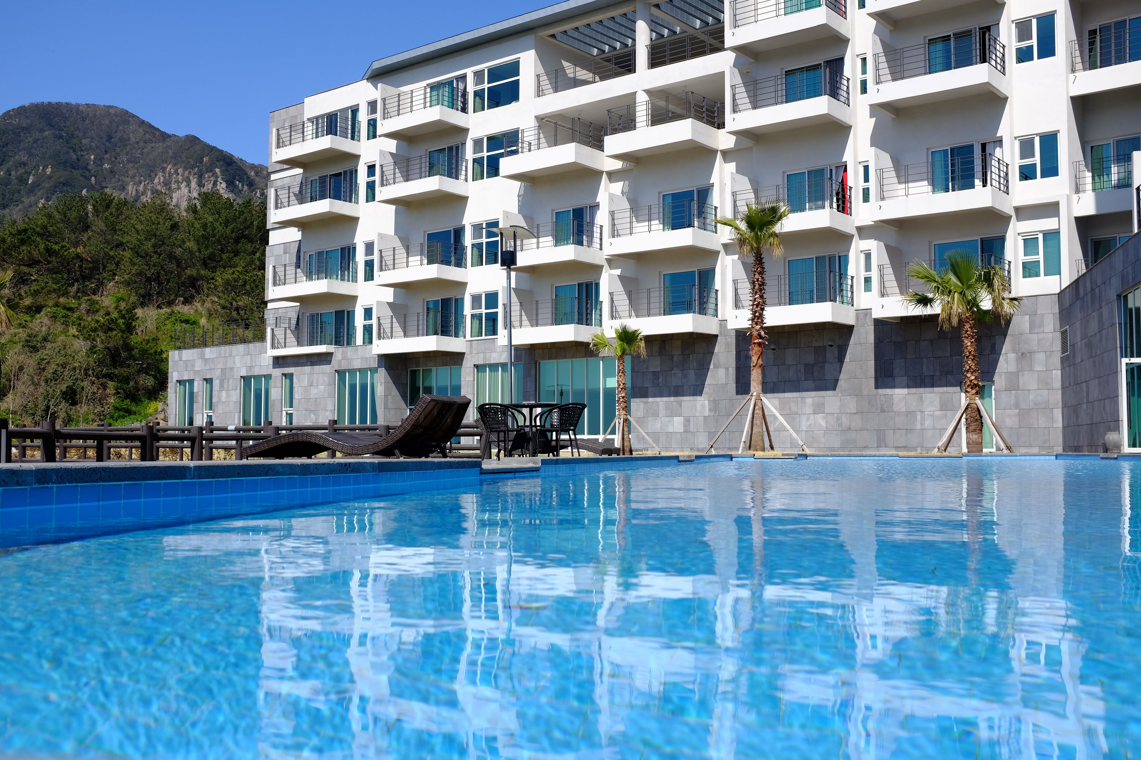 Seasonal outdoor pool, open 1:00 PM to 9:00 PM, pool umbrellas