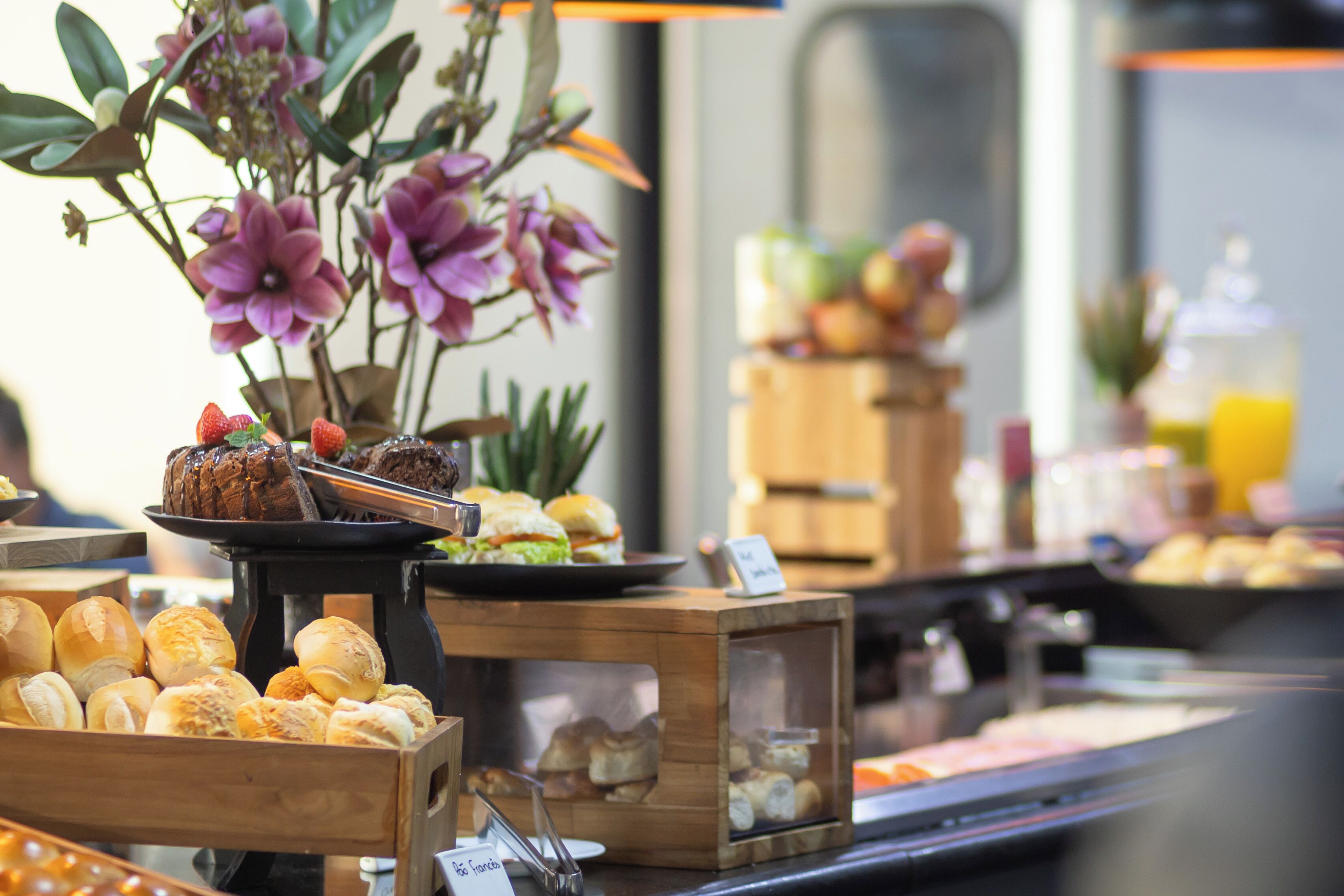 A breakfast buffet with various food items and a sign indicating 'French Toast'.