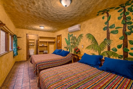 Village Room - 2 Queens | Sistema de insonorización, wifi gratis, ropa de cama. El Sano Banano Beachside Hotel