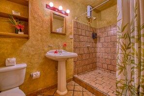 Village Room - 1 Queen, 1 Single (downtown view) | Bathroom | Shower, towels - El Sano Banano Beachside Hotel (Cóbano)
