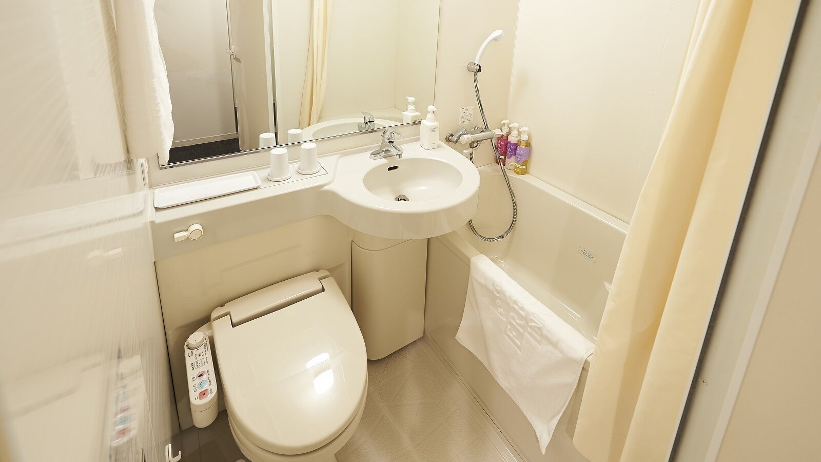 combined shower/bathtub, hair dryer, slippers, electronic bidet