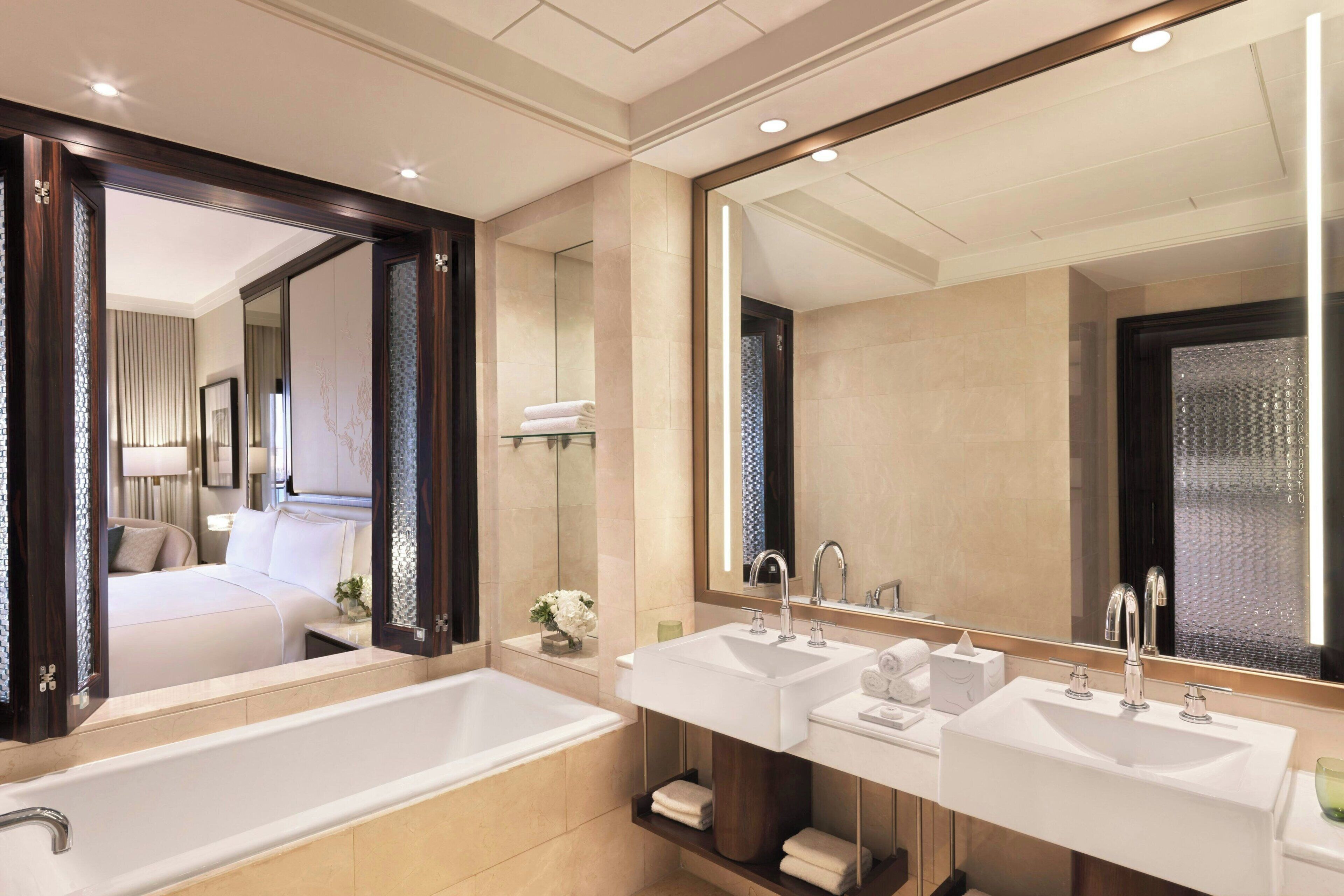 Separate bathtub and shower, designer toiletries, hair dryer, bathrobes
