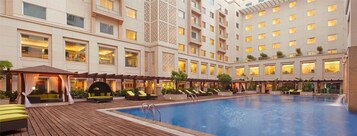 Outdoor pool, pool umbrellas, sun loungers