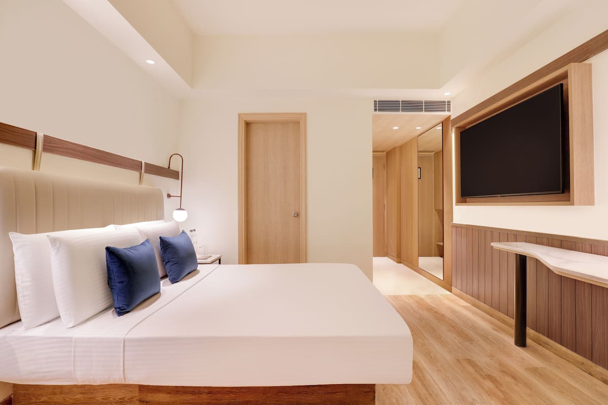 Sengetøy av topp kvalitet, memory foam-senger, minibar og safe på rommet