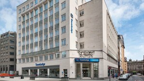 A Travelodge hotel with a modern facade, multiple windows, and a prominent entrance. - Travelodge Liverpool Central Exchange Street (Liverpool)