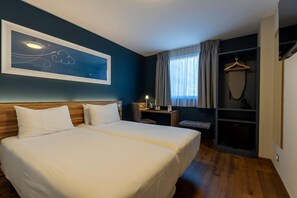 Luxe beddengoed, donsdekens, pillowtop-bedden, een minibar