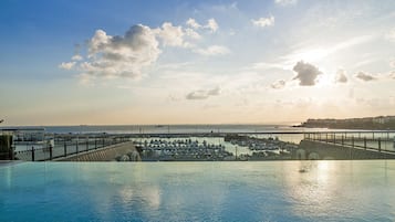 Indoor pool, seasonal outdoor pool, free pool cabanas, pool umbrellas
