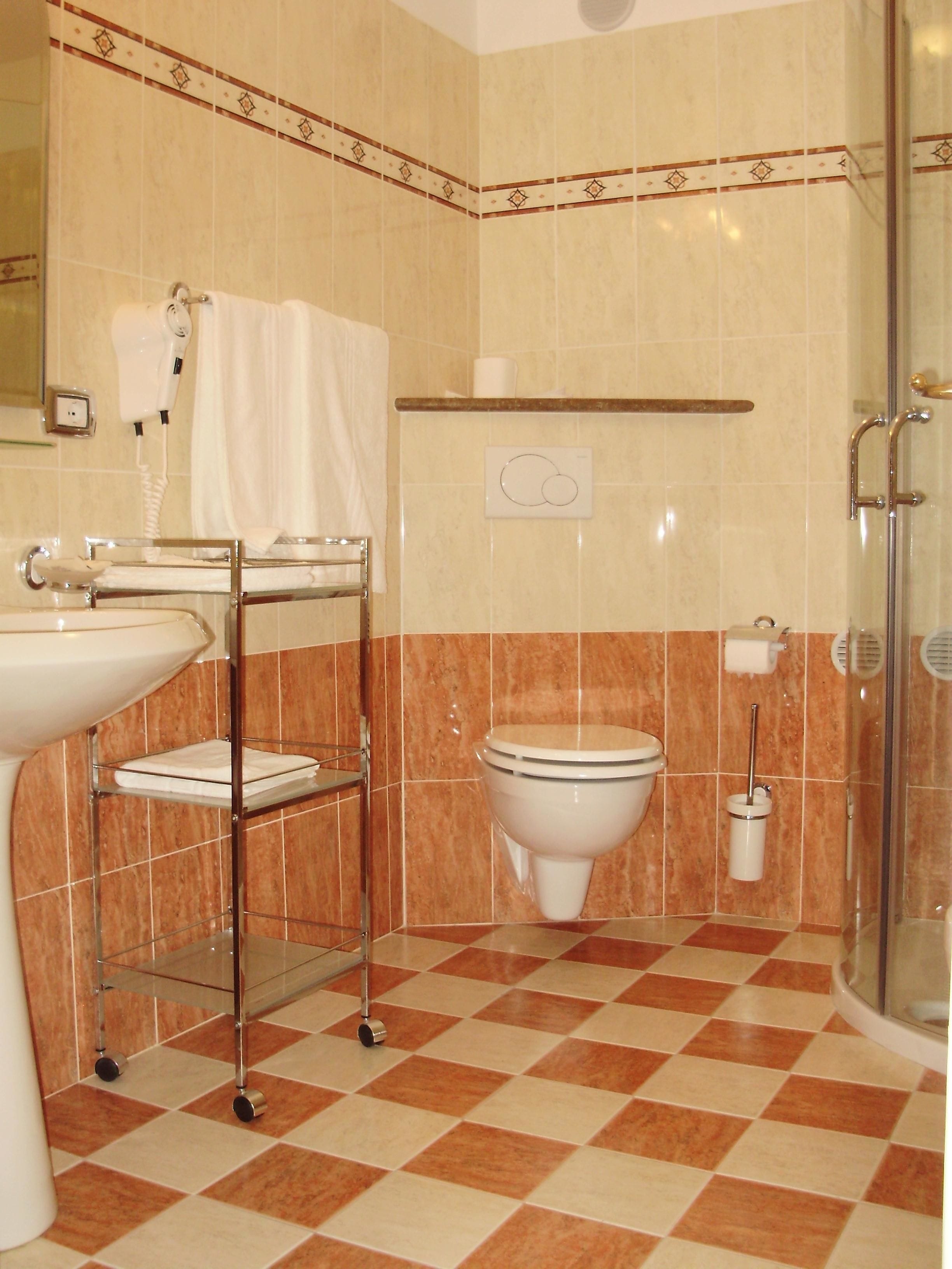 triple room | bathroom | rainfall showerhead, free toiletries, hair dryer, bidet
