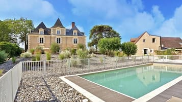 Seasonal outdoor pool, pool loungers