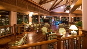 A spacious lobby with wooden flooring, large windows, and multiple seating areas. - Maneechan Resort & Sport Club (Chanthaburi)