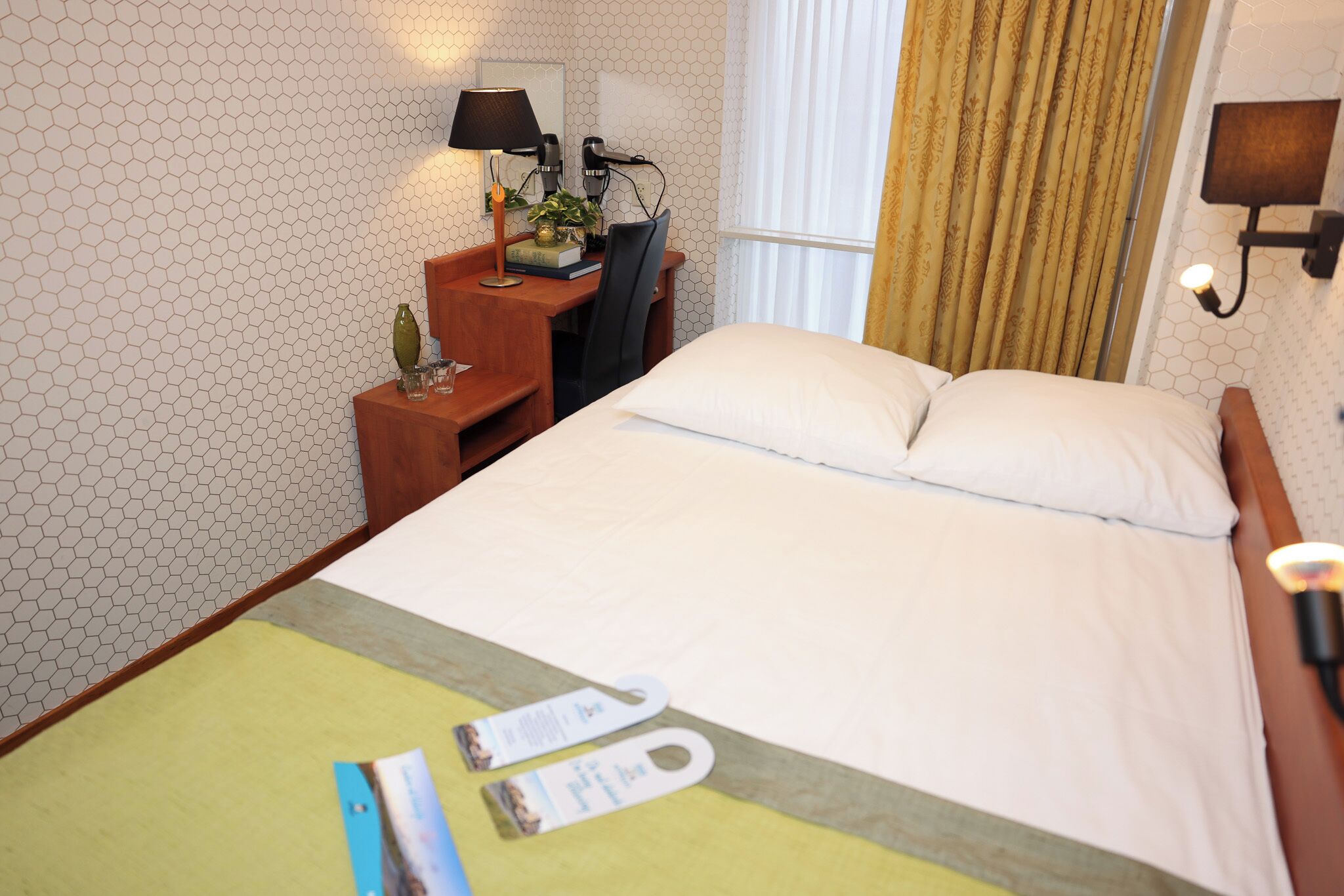 Hypo-allergenic bedding, in-room safe, desk, blackout curtains