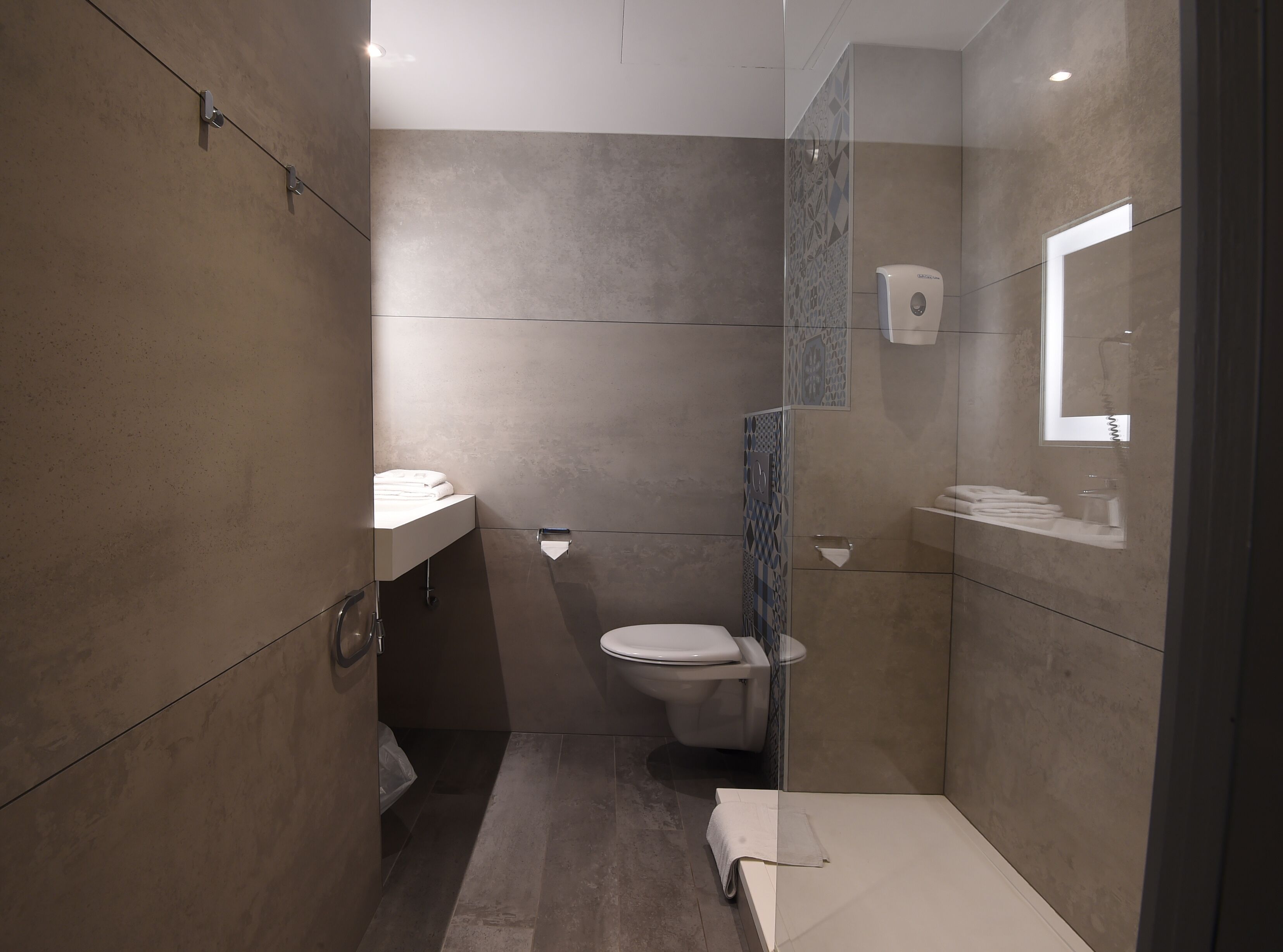 eco-friendly toiletries, hair dryer, towels