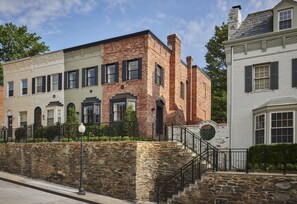 Rows of historic buildings with unique architectural styles and traditional shutters.