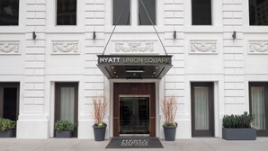 A building with a sign reading 'HYATT UNION SQUARE' above the entrance.