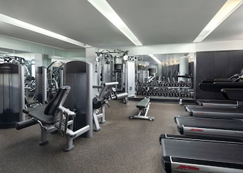 A modern interior with a high ceiling, white walls, and a central island with a sink. at Hyatt Union Square New York