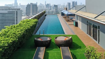 Outdoor pool, open 7:00 AM to 10:00 PM, pool umbrellas, sun loungers