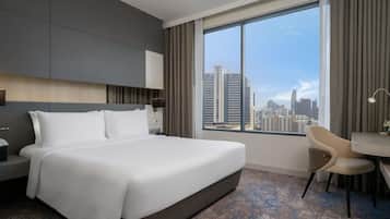 Suite Deluxe, 1 cama Queen size | Caja de seguridad en la habitación y escritorio