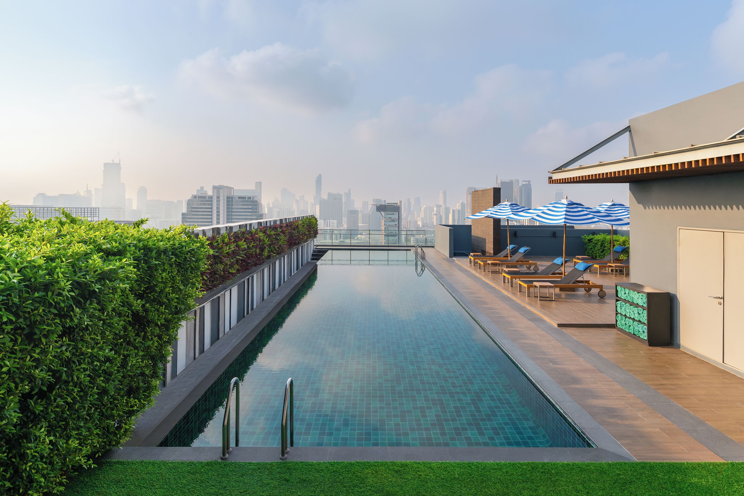 Outdoor pool, open 7:00 AM to 10:00 PM, pool umbrellas, pool loungers