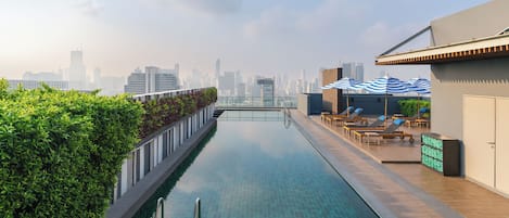 Outdoor pool, open 7:00 AM to 10:00 PM, pool umbrellas, pool loungers